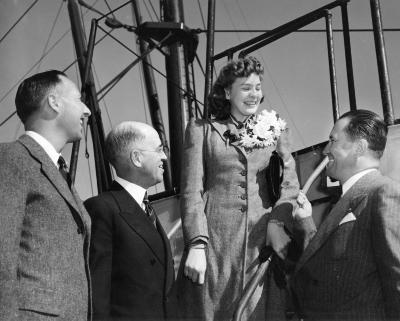 Iola Whitlock boarding ship for Hawaii, 3 unidentified men seeing her off (San Francisco, California)