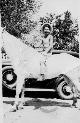 Dave Brubeck on horseback in front of car (Ione, California)