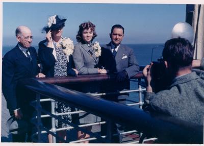 Iola Whitlock, Myrtle Whitlock, 2 unidentified bankers on shipboard