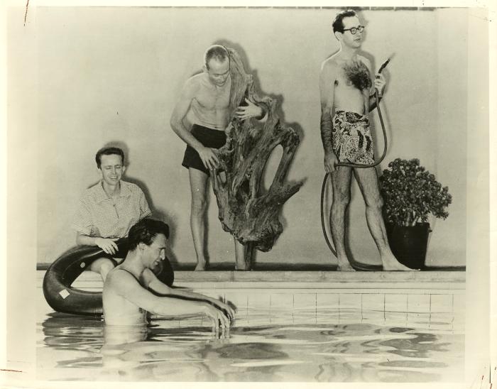 Dave Brubeck in swimming pool, Lloyd Davis with inner tube, Ron Crotty playing "driftwood bass" and Paul Desmond on the "alto hose"