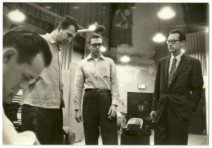 Norman Bates (profile, in foreground), Dave Brubeck, Joe Morello, and Paul Desmond listening to playback #1 (New York City, New York [?])