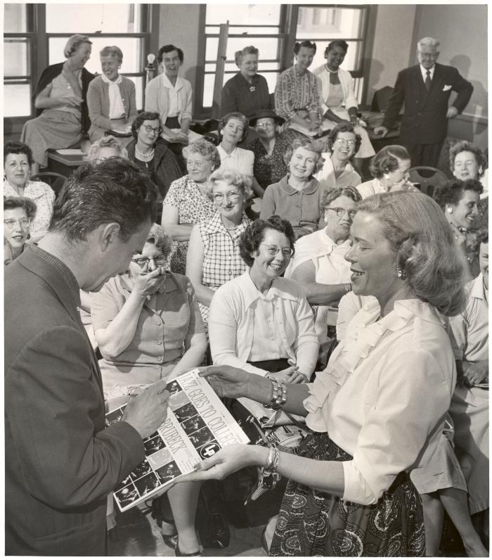 Dave Brubeck autographing cover "Jazz Goes to College" for Mrs. Ilene Holmgren of Orinda during a "Dave teaches teachers" session for Alameda County school teachers (California)