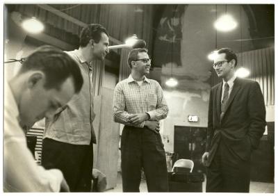 Norman Bates (foreground), Dave Brubeck, Joe Morello, and Paul Desmond listening to playback #3 (New York City, New York [?])