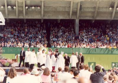 Pope greeting dignitaries on Papal Dais including Dave Brubeck, Russell Gloyd on occasion of Papal visit #6 (Candlestick Park, San Francisco, California)