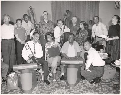 Dave Brubeck, Louis Armstrong, Carmen McRae, and others posing at St. Francis Hotel during rehearsal for Monterey Jazz Festival (San Francisco, California)