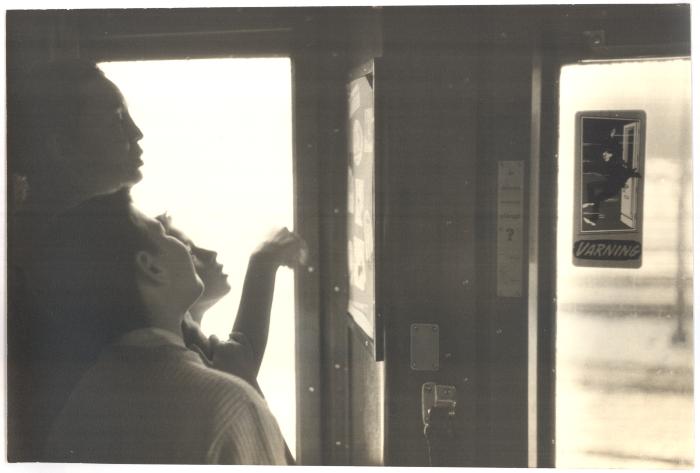 Iola Brubeck (in silhouette), Michael Brubeck, Darius Brubeck on a train (Poland,)