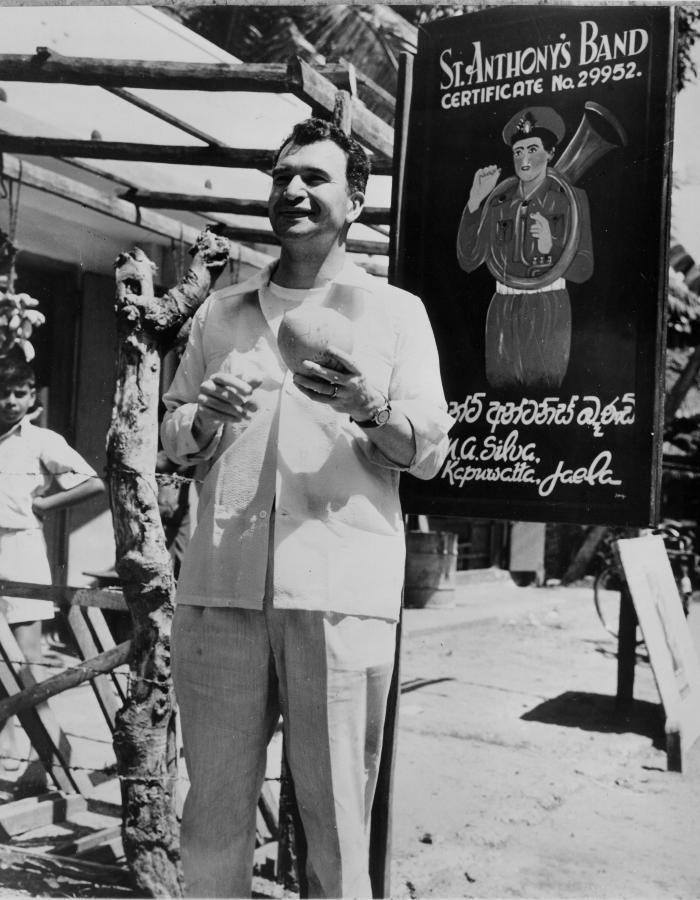 Dave Brubeck standing in front of "St. Anthony's Band" sign (Colombo, Sri Lanka)