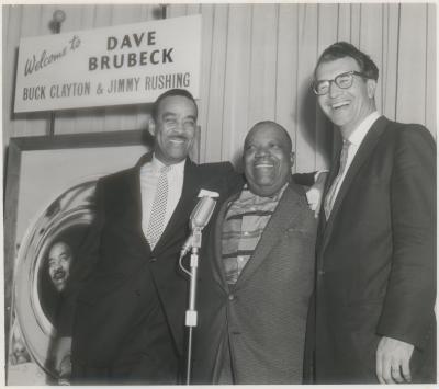 Buck Clayton, Jimmy Rushing and Dave Brubeck (L-R) at a reception in their honor (London, United Kingdom)