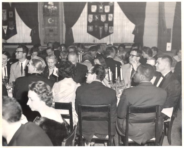 Dave Brubeck, Iola Brubeck, United States Ambassador, Joe Morello, Mrs. Morello [?], Eugene Wright, Paul Desmond, unidentified others at Rotary Club Dinner (Ankara, Turkey)