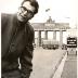 Dave Brubeck wearing an overcoat, gloves, and glasses at the Brandenburg Gate (Berlin Wall, Berlin, West Germany)