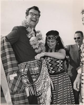 Dave Brubeck being fitted with a Maori skirt at airport (Wellington, New Zealand)