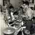 Dave Brubeck giving music lesson to Darius Brubeck, Michael Brubeck, Chris Brubeck, Dan Brubeck, with Iola Brubeck and Catherine Brubeck watching (Wilton, Connecticut)