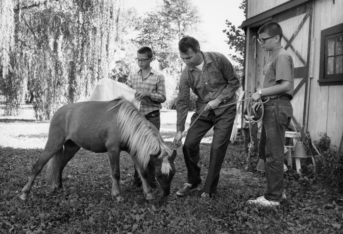 Dave Brubeck and two of his sons with a pony at Irving Townsend house (Wilton, Connecticut)