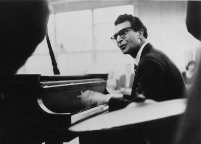 Dave Brubeck in performance, dark suit, glasses