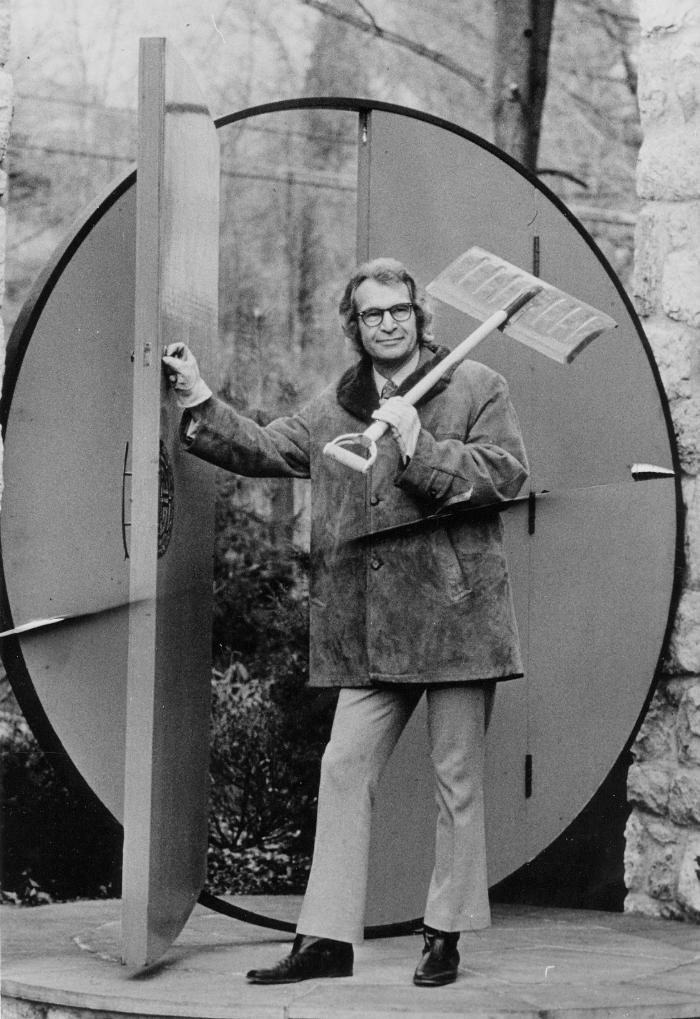 Dave Brubeck with snow shovel in front of his home's circular gate (Wilton, Connecticut)