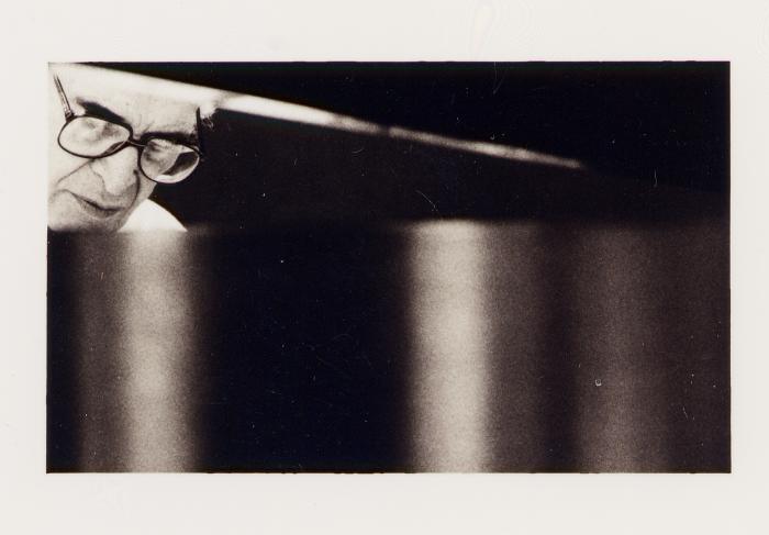 Dave Brubeck seen through slant of piano lid