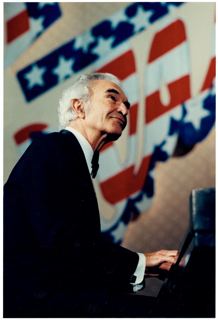 Dave Brubeck playing in front of American flag